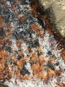 water cascading over lovely speckled granite.
